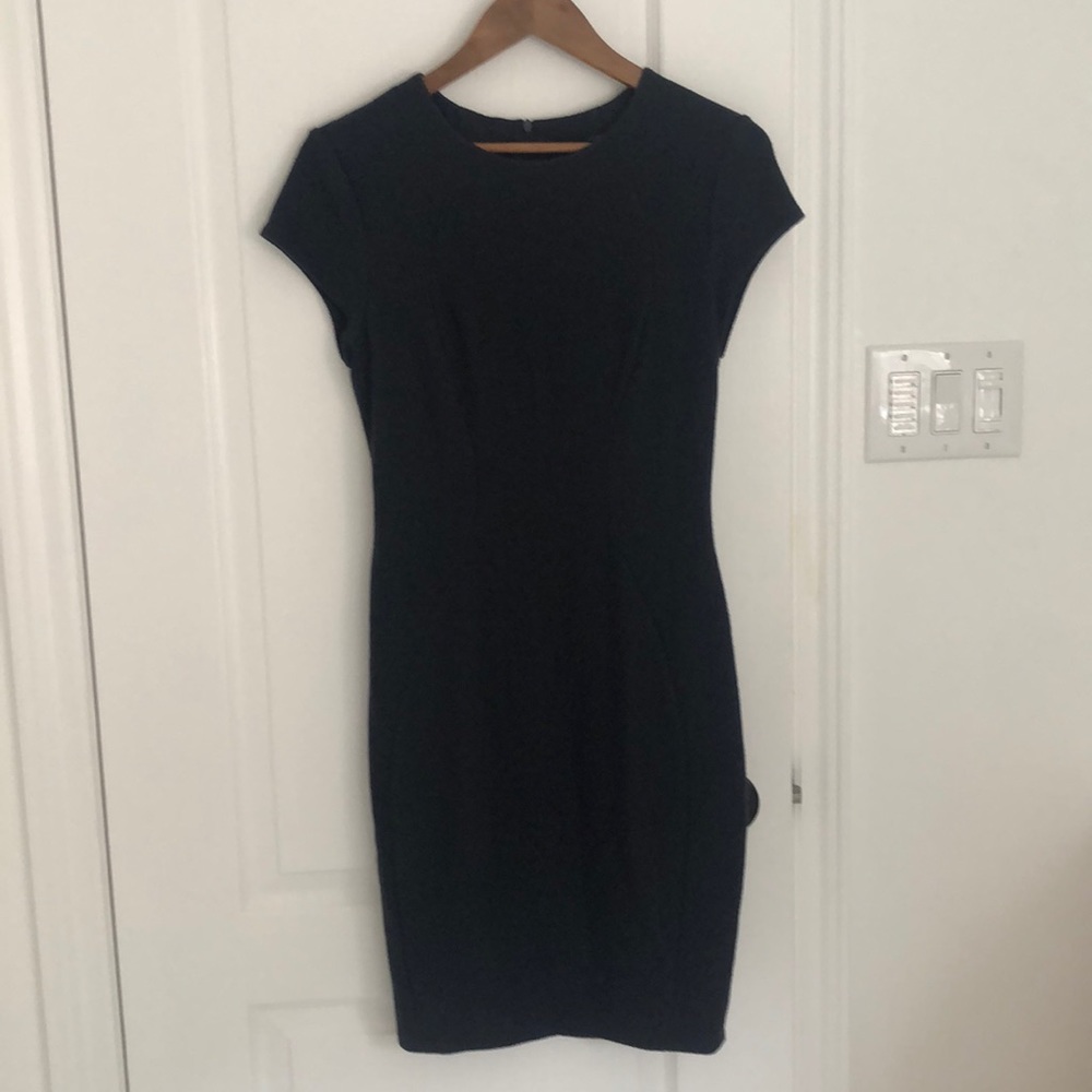 Stunning body con designer dress by Obakki size 8
Dark navy